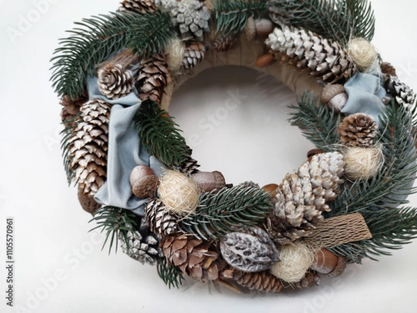 Fototapeta Christmas Wreath of pine branches, cones, leaves, beads and snowflakes. Holiday Decoration Gift For family and friends. New Year's home wall decor different angles handmade top view, side view