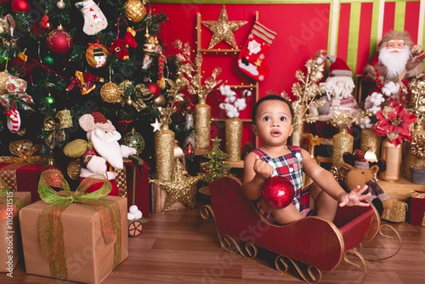 Fototapeta baby boy posing for photo with Christmas background