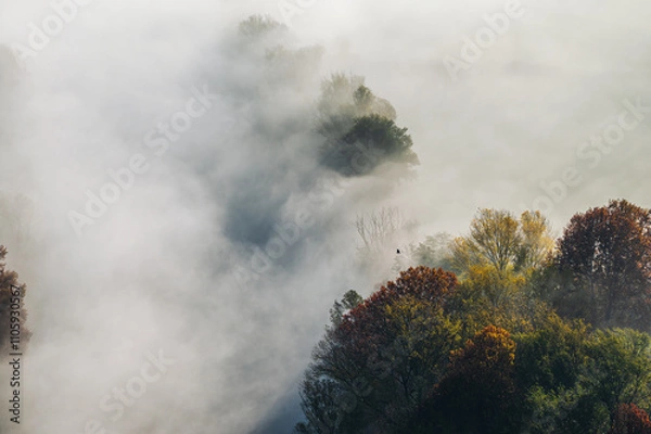 Obraz autumnal foggy morning sunrises over the Adda river, Lecco, Italy 