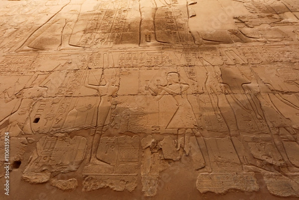 Fototapeta Inscriptions and reliefs in the great hypostyle hall in Karnak Temple near Luxor, Egypt