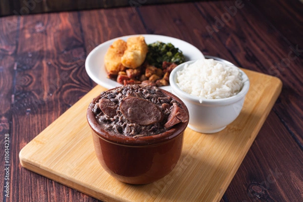 Fototapeta Bowl with feijoada and spices Typical Brazilian food