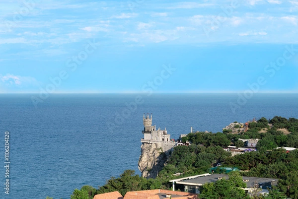 Obraz Journey to Crimea. The attraction of the city of Yalta is the Swallow's Nest Palace against the background of the Black Sea. Selective focus,