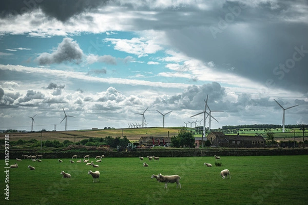 Fototapeta Wind turbines in a green fields of Yorkshire on a cloudy, moody day, UK