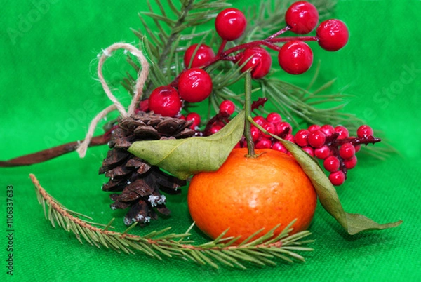 Fototapeta A spruce branch with a pine cone and a tangerine with leaves on a beautiful background, holiday, Christmas.