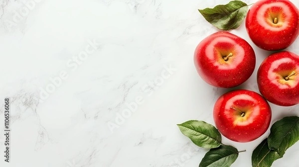 Obraz Fresh Red Apples with Leaves on Marble Surface
