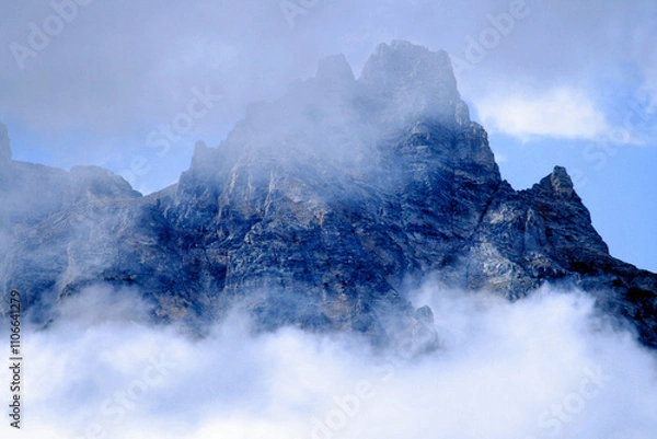 Obraz Fog and clouds on  rugged mountain peak