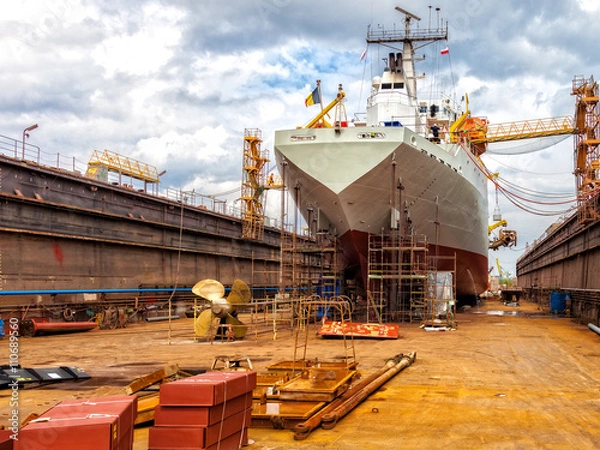 Fototapeta Big ship - rear view with propeller under repair.