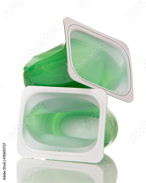 Obraz Crushed plastic cups  yogurt isolated on white background.
