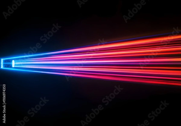 Fototapeta A vibrant light beam with multiple colors of red, blue, and purple against a black background.