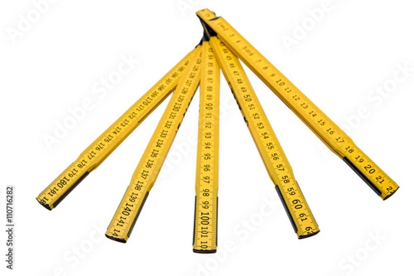 Obraz Folding ruler isolated, yellow carpenter's rule with centimeters numbers.
