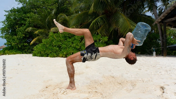 Fototapeta Young guy on the beach