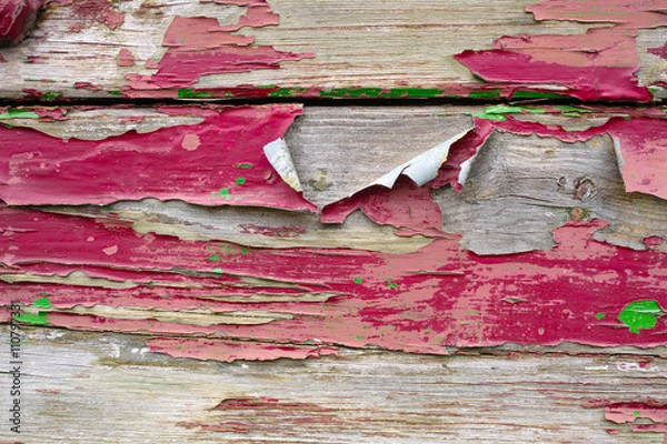 Fototapeta Old red paint layer on textured wooden planks