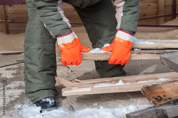 Fototapeta Carpenter working at sawmill 