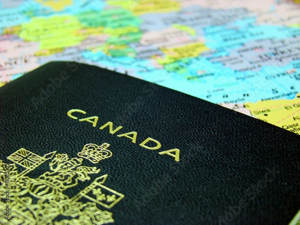 Fototapeta Photo of a Canadian passport against map of Europe.