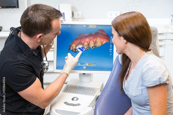Obraz Dentysta doradzający pacjentowi w zakresie technologii dentystycznej CEREC