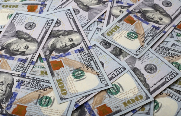 Fototapeta Abstract background many of US dollars on black boards