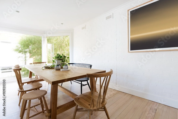 Fototapeta Scandinavian styled dining room interior with contemporary artwo