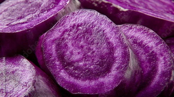Obraz A macro shot of a purple ube yam, sliced to show its vivid violet color inside