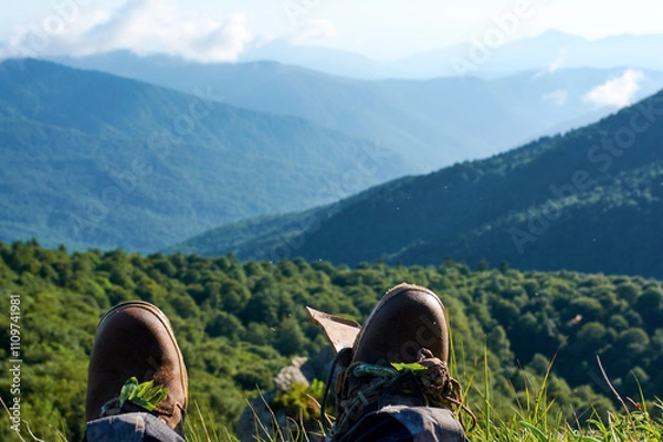 Obraz Hiking torn boots is hang on background mountains