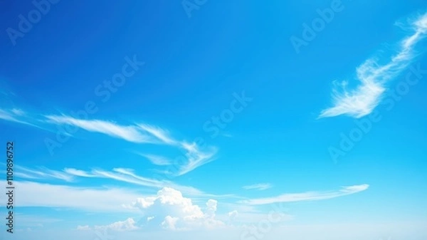 Obraz A vast blue sky with delicate white wispy clouds creating a serene and tranquil atmosphere