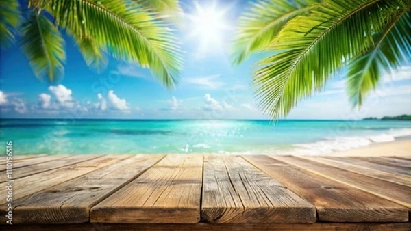 Fototapeta A wooden plank table set against a backdrop of a tropical ocean, framed by vibrant green palm fronds, with a radiant sun illuminating the scene.