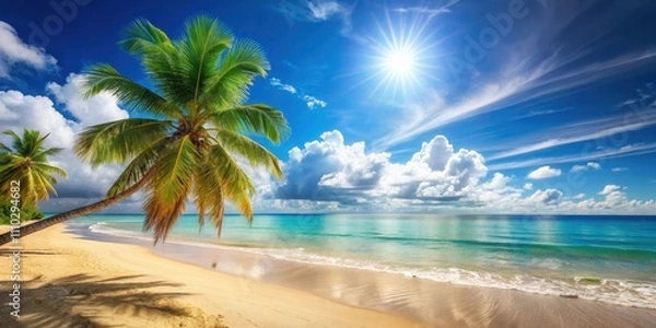 Fototapeta Palm Tree Overlooking a Pristine Tropical Beach with White Clouds and a Bright Blue Sky