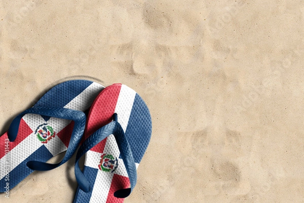 Fototapeta Thongs with flag of Dominican Republic, on beach sand
