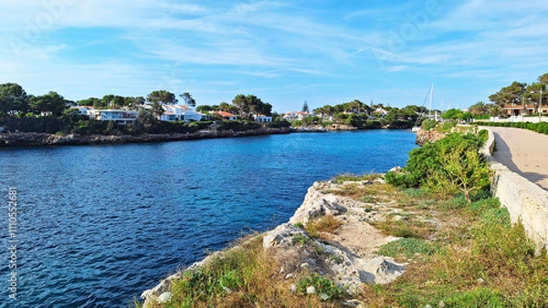 Obraz Seafront of the Ciutadella de Menorca, Balearic Islands, Spain. Entrance of the port with the Sa Farola Lighthouse on the opposite headland. 