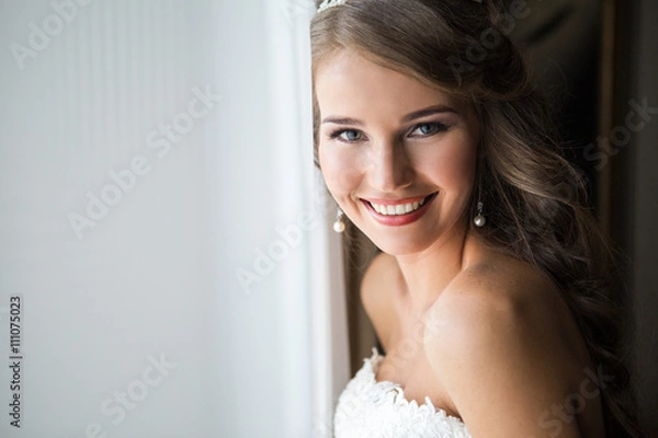 Obraz happy bride smiling at the camera