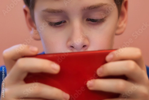 Obraz Close-up of a teenager's eyes staring at a smartphone