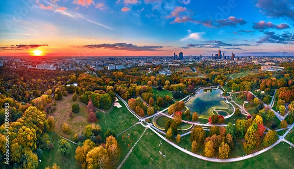 Obraz A beautiful panoramic aerial drone view of the sunset at Pola Mokotowskie in Warsaw, Poland - "Mokotow Field" is a large park in Warsaw - Is called "Jozef Pilsudski Park" or "Warsaw Central Park"