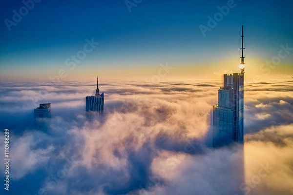Obraz Beautiful panoramic fabulous, mesmerizing, unreal, aerial drone view of skyscrapers sticking out of low fog at sunrise, Warsaw, Poland, EU. VARSO - the tallest skyscraper in EU.