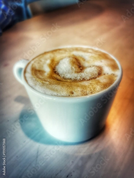 Obraz delicious cup of coffee on a wooden table