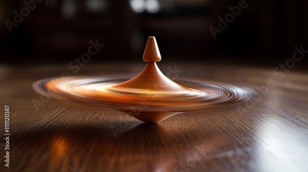 Fototapeta A spinning top in motion on a wooden surface, showcasing balance and kinetic energy.