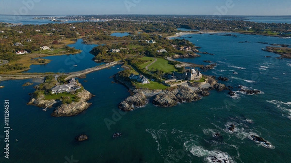 Fototapeta OCTOBER 2022, NEWPORT, RI - USA - Aerial view of Newport Rhode Island on ocean shows wealthy mansions