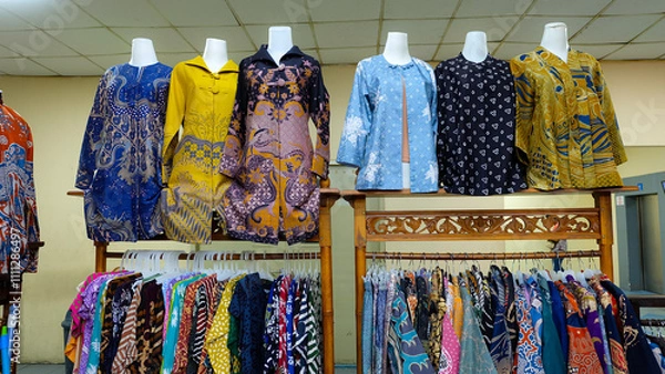 Fototapeta Colorful batik clothing displayed on mannequins and racks. Perfect for fashion blogs or promoting Indonesian culture