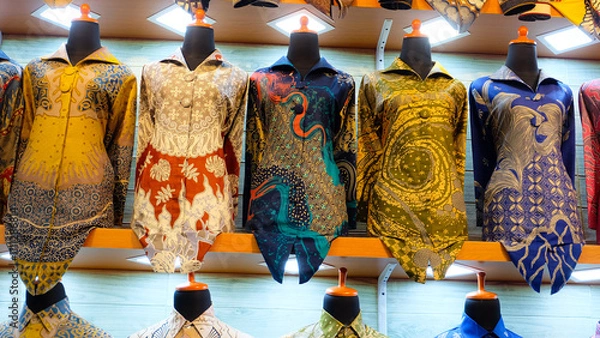 Fototapeta Colorful batik cloth on display in a shop. Perfect for fashion blogs or promoting Indonesian culture.