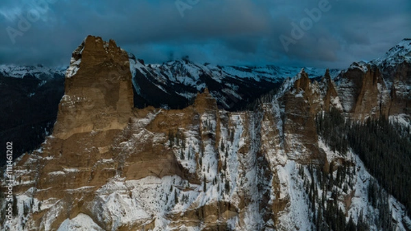 Fototapeta OCTOBER 12, 2023, RIDGWAY, CO., USA - sunset view of Cimarron Mountains near Ridgway Colorado in autumn with fresh snow - "Court House" view