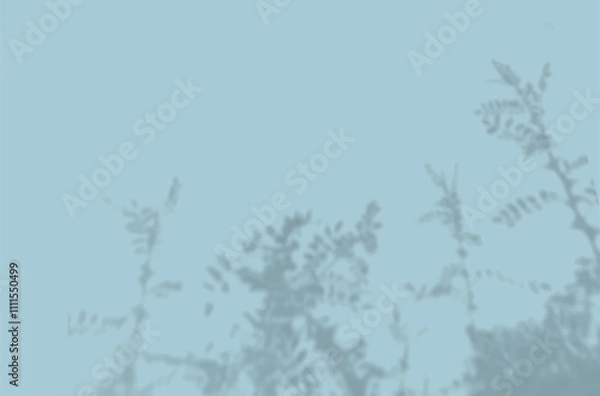 Fototapeta The shadow of the flower leaves on the blue wall. Black and white image for photo overlay or mockup