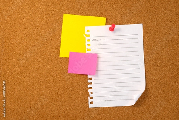 Fototapeta Blank sticky note paper on cork board wall. Noticeboard to organize life and work concept