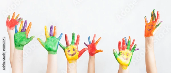 Obraz Lot of painted hands raised up, Children's Day