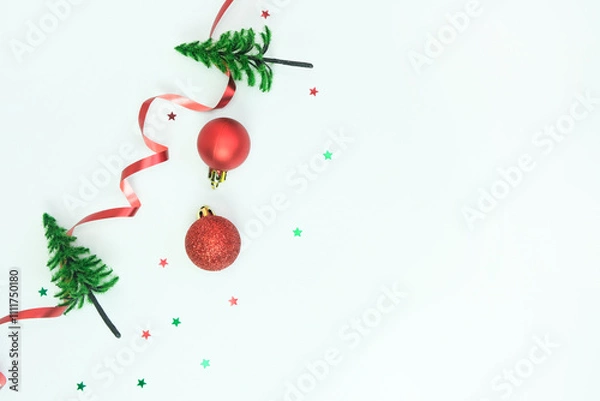 Fototapeta Christmas ornament in the form of decorative Christmas trees on white. Top view, space for text.