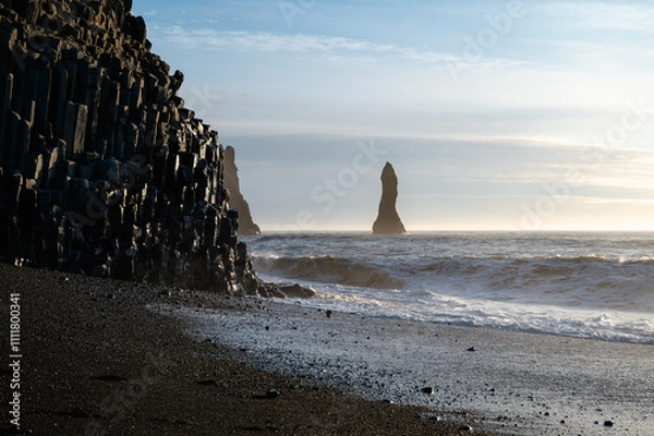 Obraz Reynisfjara black sand beach in Iceland. Ocean cliffs. Sunny day. Seascape. Touristic place.