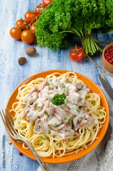 Fototapeta Spaghetti with Bechamel sauce, mushrooms and bacon