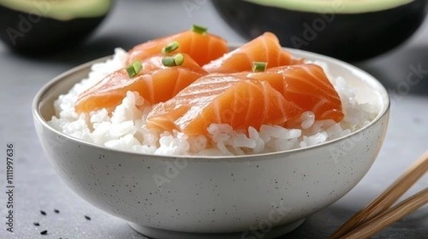 Fototapeta Fresh Salmon Slices on Rice in Elegant Bowl with Chives