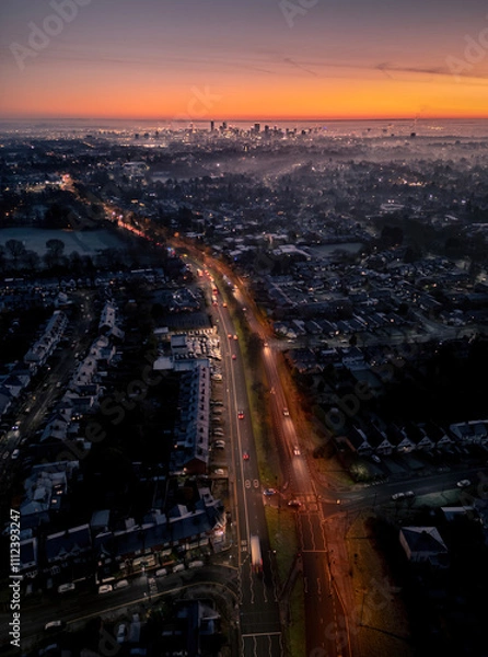 Obraz Awe-inspiring drone view of Birmingham city and the West Midlands at sunrise, with golden skies