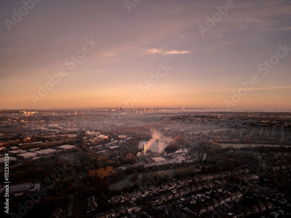 Obraz Drone view of Birmingham city at sunrise, highlighting the industrial landscape in the foreground