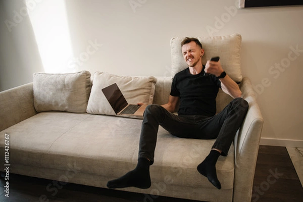Fototapeta Businessman analyst trader winner. Fortune, winning, win, concept. Extremely happy man reading cool news on financial market. Stock Market Rise. Trading online investment data on stock market graph.