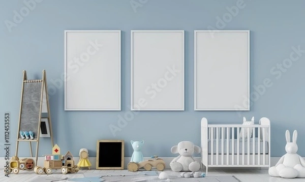 Fototapeta Three blank frames above a crib. toys. and a mirror in a baby s nursery with blue walls