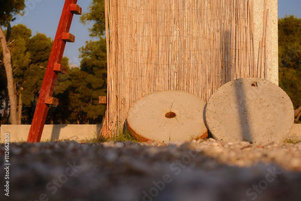 Fototapeta Two stone circles lie near the stone wall